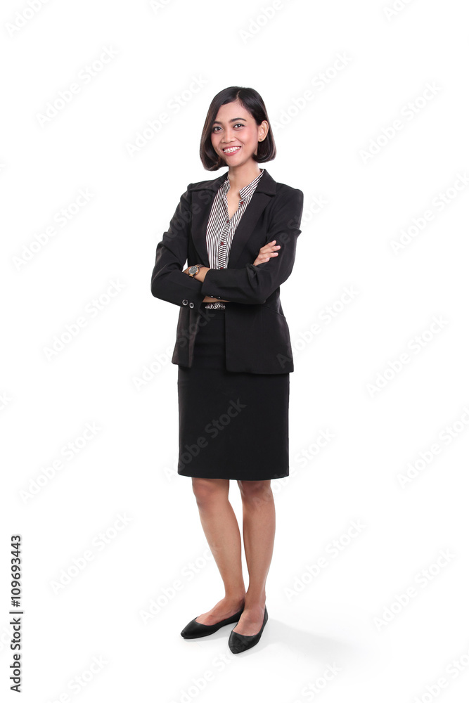 Confident businesswoman standing with arms folded Confident businesswoman standing with arms folded