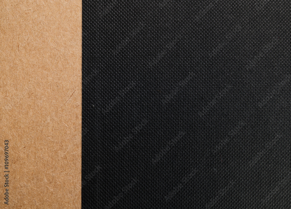 Fototapeta premium black fabric texture with brown paper strip