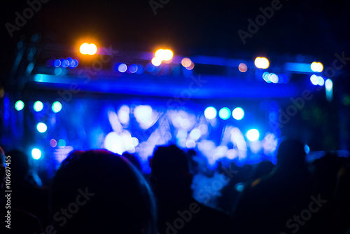 Intentionally blurred people viewing live concert