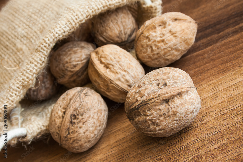 Organic walnuts in small storage bag. Organic walnuts in small storage bag.