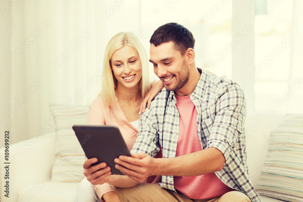 smiling happy couple with tablet pc at home smiling happy couple with tablet pc at home