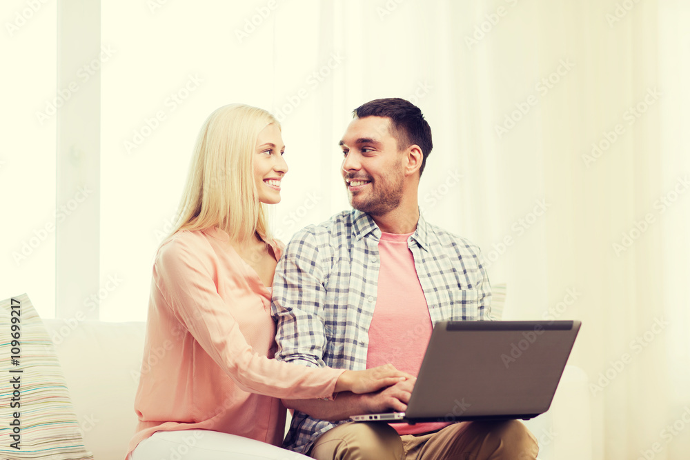 smiling happy couple with laptop computer at home smiling happy couple with laptop computer at home
