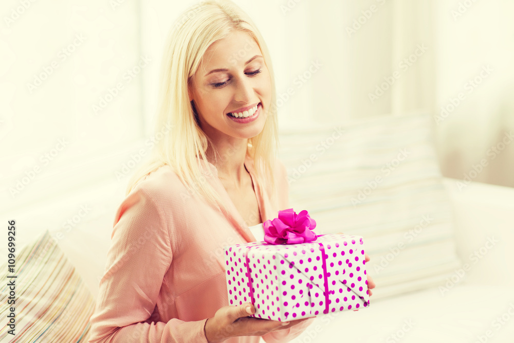 smiling woman with gift box at home smiling woman with gift box at home