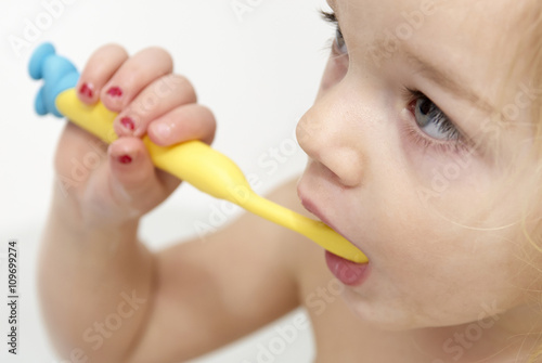 Dental hygiene. Close up of little girl brushing her teeth