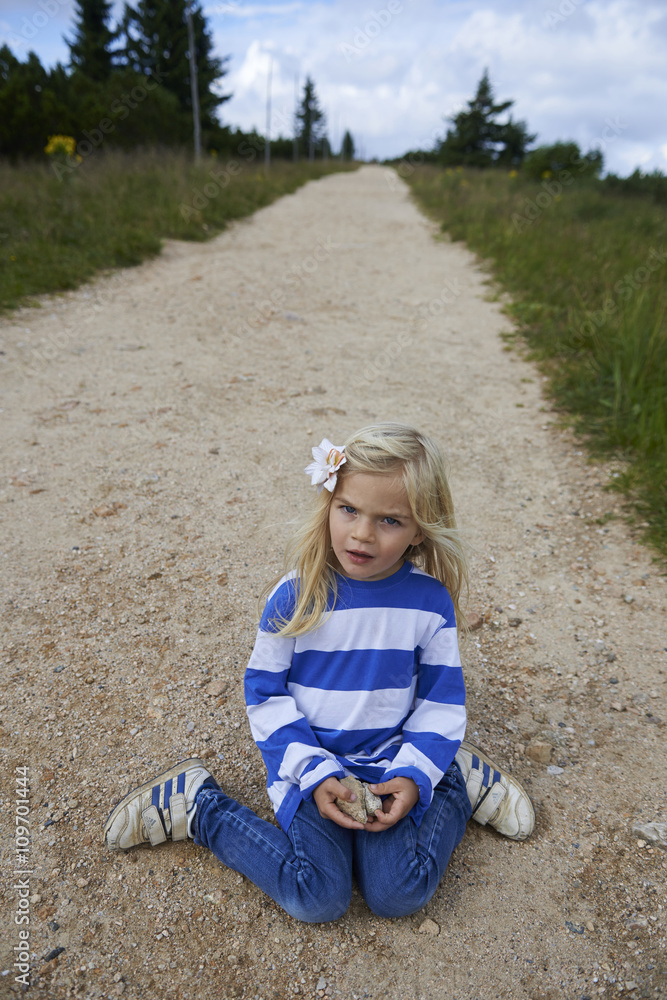 Child blond girl tourist on the mountain dirt road, Giant Mountains Czech Republic Europe
Child blond girl tourist on the mountain dirt road, Giant Mountains Czech Republic Europe