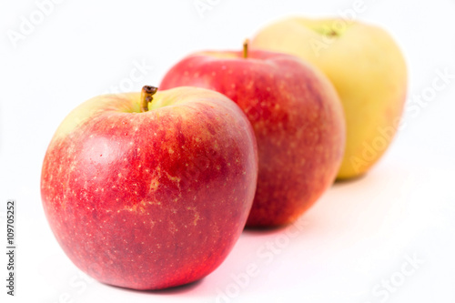 Three apples on white background