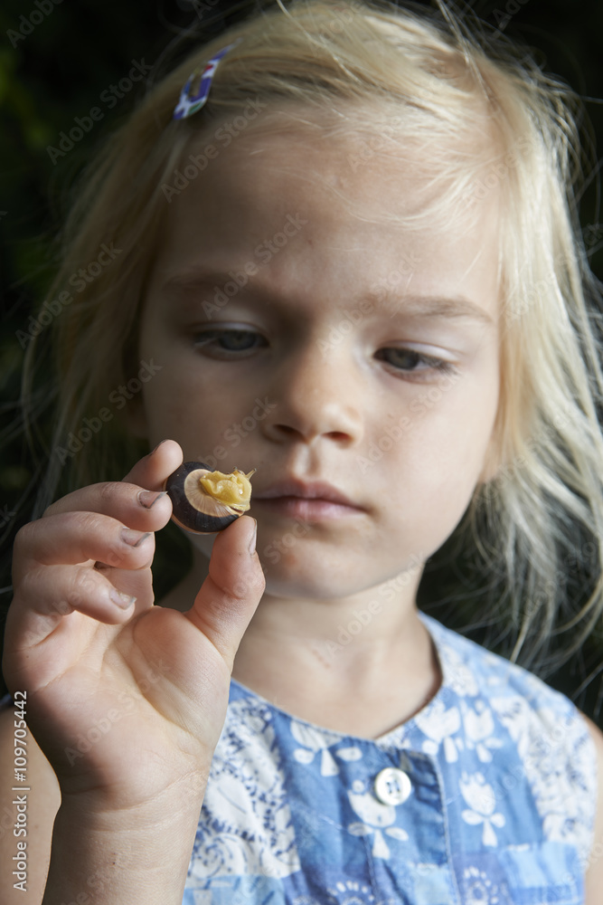 little young beautiful girl holding small snail in hand little young beautiful girl holding small snail in hand