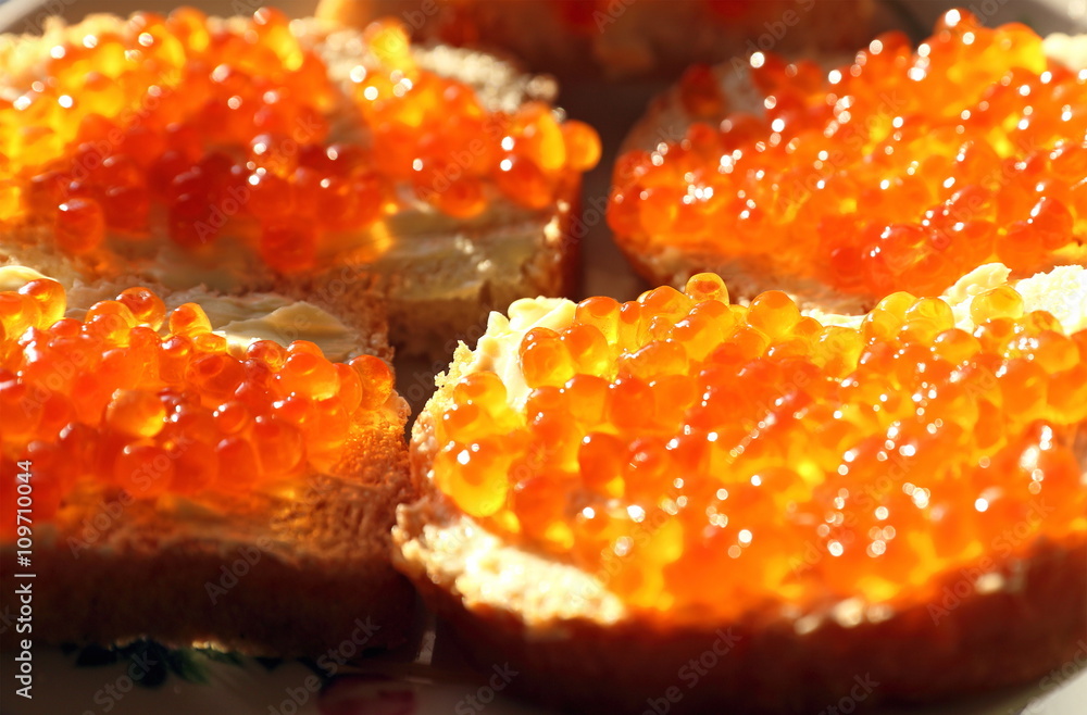 Red caviar with bread and oil