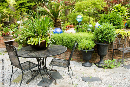 Outdoor Patio Furniture in a Landscaped Flower Garden