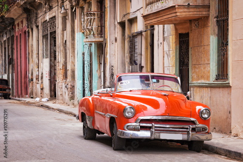 Vintage classic american car in a street in Old Havana, Cuba © Delphotostock