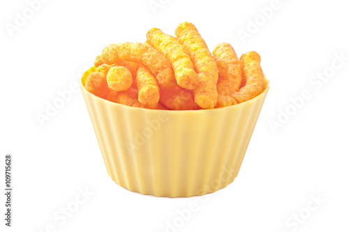cheese puffs in plastic bowl