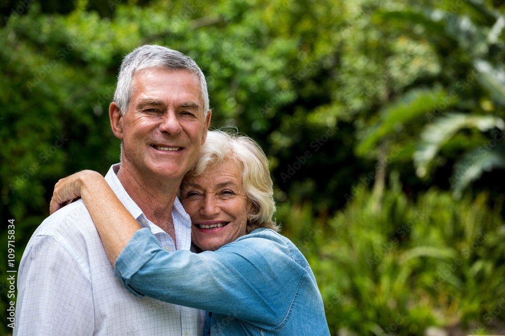 Cheerful senior couple against plants Cheerful senior couple against plants