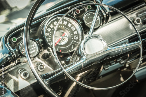 retro styled 1950s vehicle dashboard and steering wheel