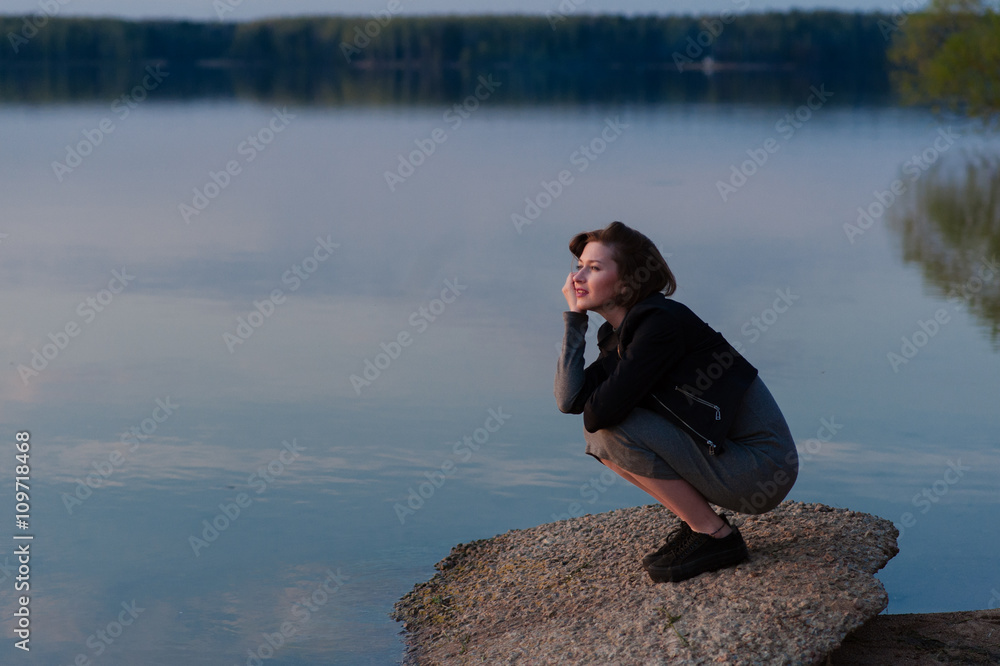 pensive girl in the nature near the water pensive girl in the nature near the water