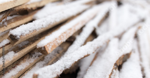 firewood in the snow in the winter © schankz