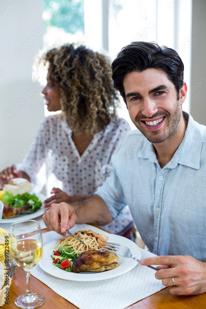 Portrait of happy man having meal
