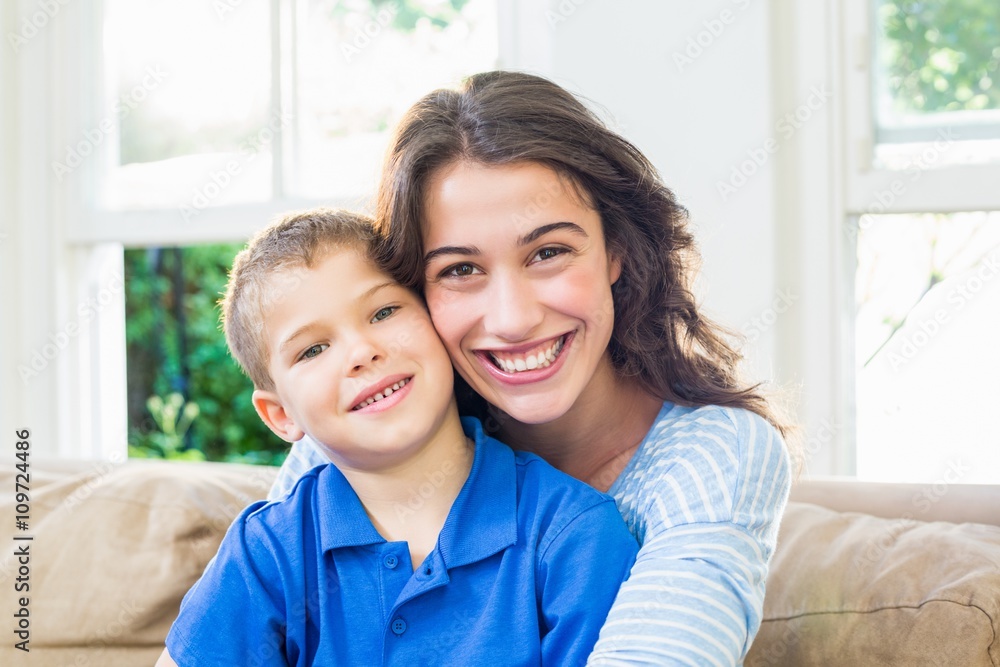 Portrait of mother and son in living room Portrait of mother and son in living room