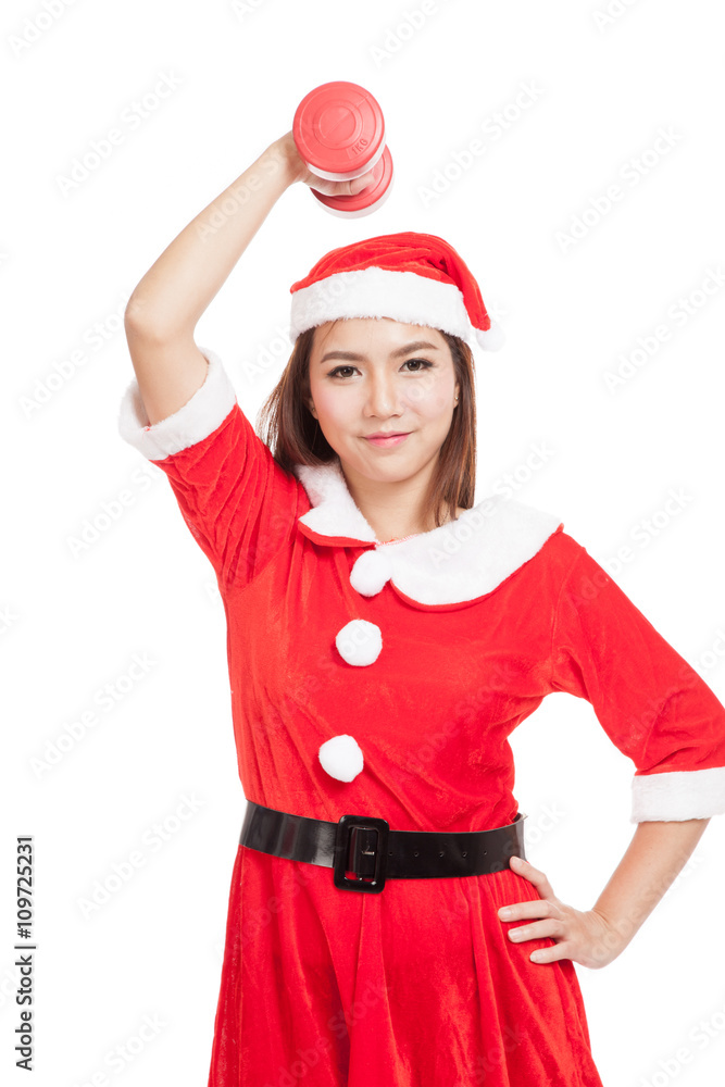 Asian Christmas girl with Santa Claus clothes and red dumbbell Asian Christmas girl with Santa Claus clothes and red dumbbell