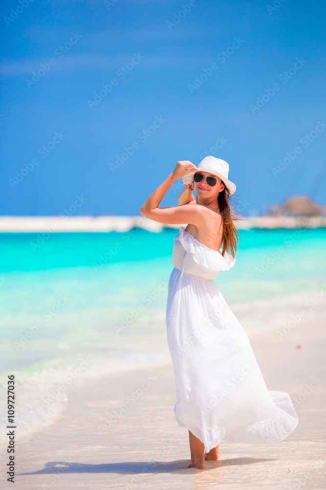 Young beautiful woman during tropical beach vacation Young beautiful woman during tropical beach vacation