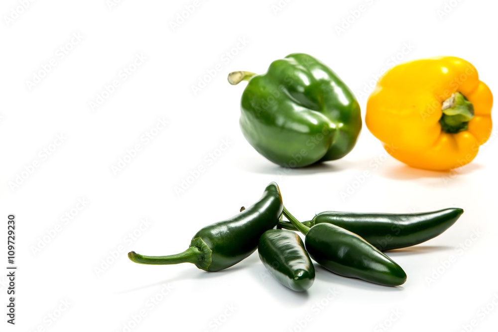Jalapeno hot pepper and paprika on a white background