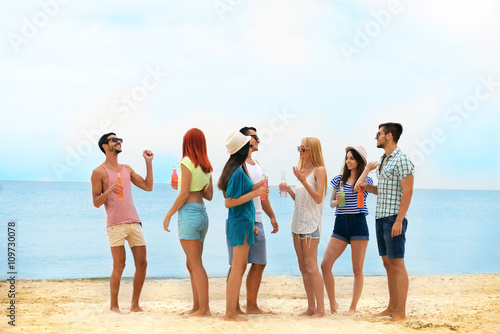 Beautiful young people having fun on beach