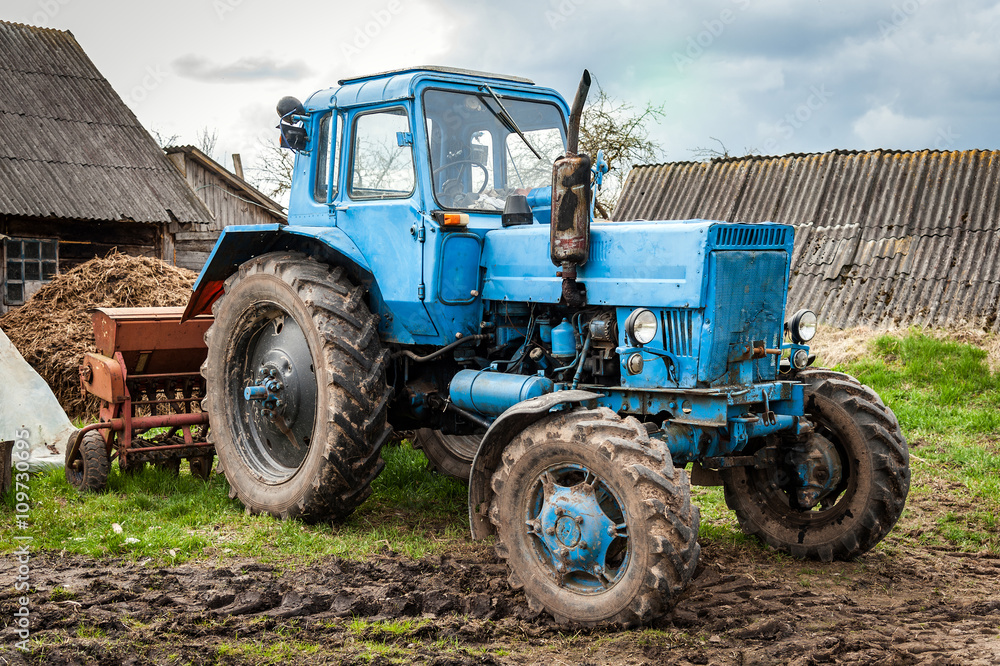 Old blue Belarus tractor on a ground Old blue Belarus tractor on a ground