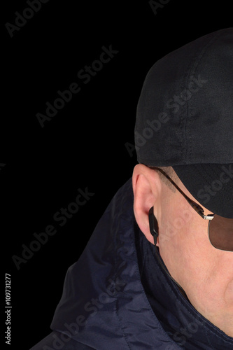 Fotografia Police security guard specops staff policeman covertly listening isolated portra