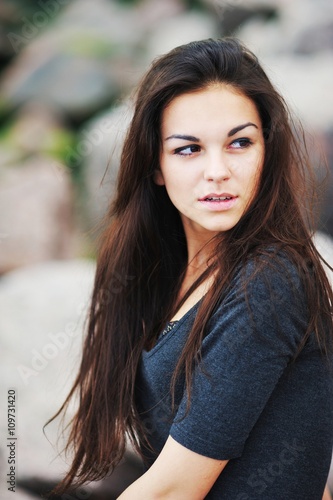 portrait of a beautiful girl with long hair in a black shirt