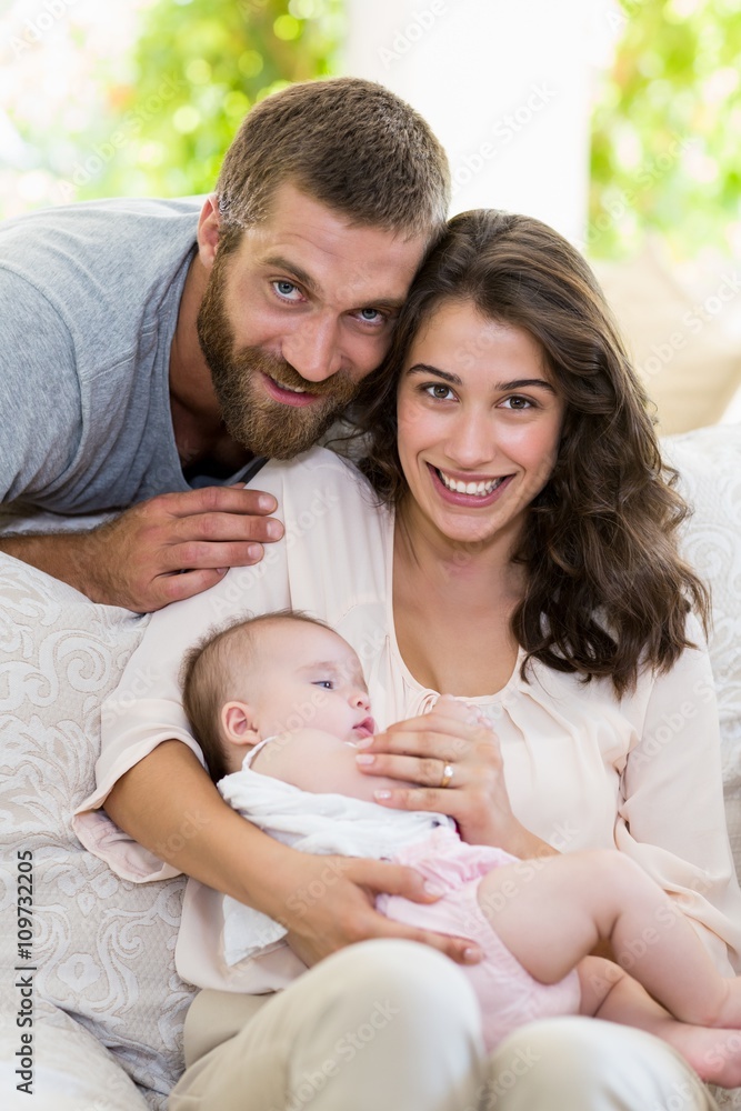 Portrait of happy parents with their baby