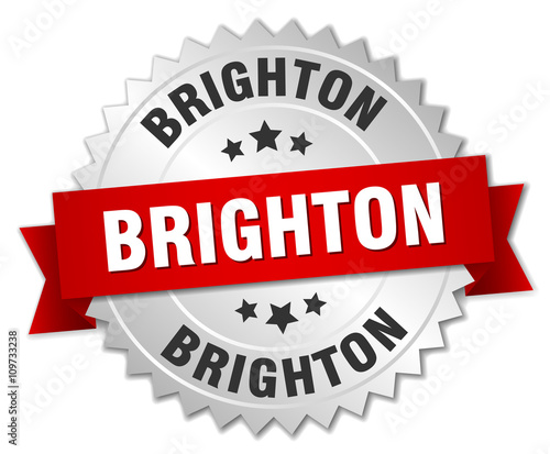 Brighton round silver badge with red ribbon