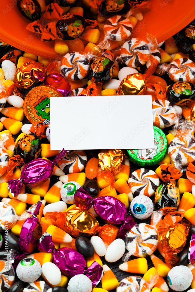 placard with colorful candies behind it.