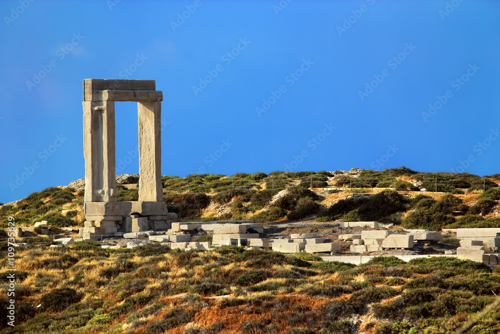 Greece. Cyclades Islands - Naxos. Temple of Apollo - the north-west portal (Portara) made from three massive blocks of marble and remains of platform