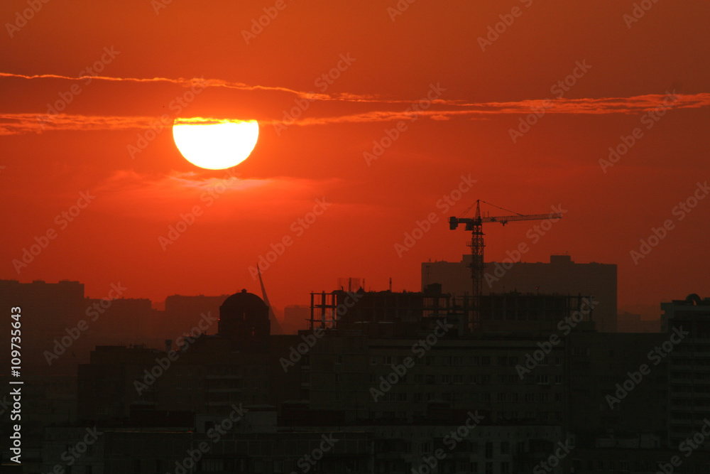 Fototapeta premium Back light construction site silhouetted at sunset