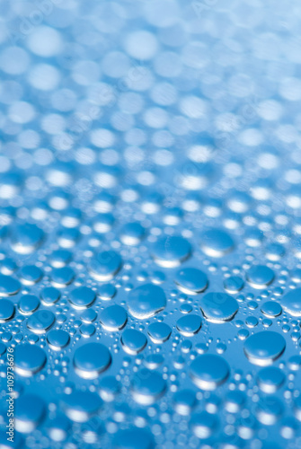 close-up of water drops on the blue background 