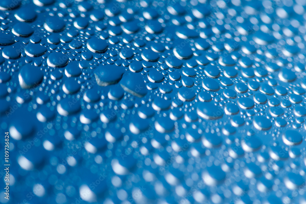 close-up of water drops on the blue background 