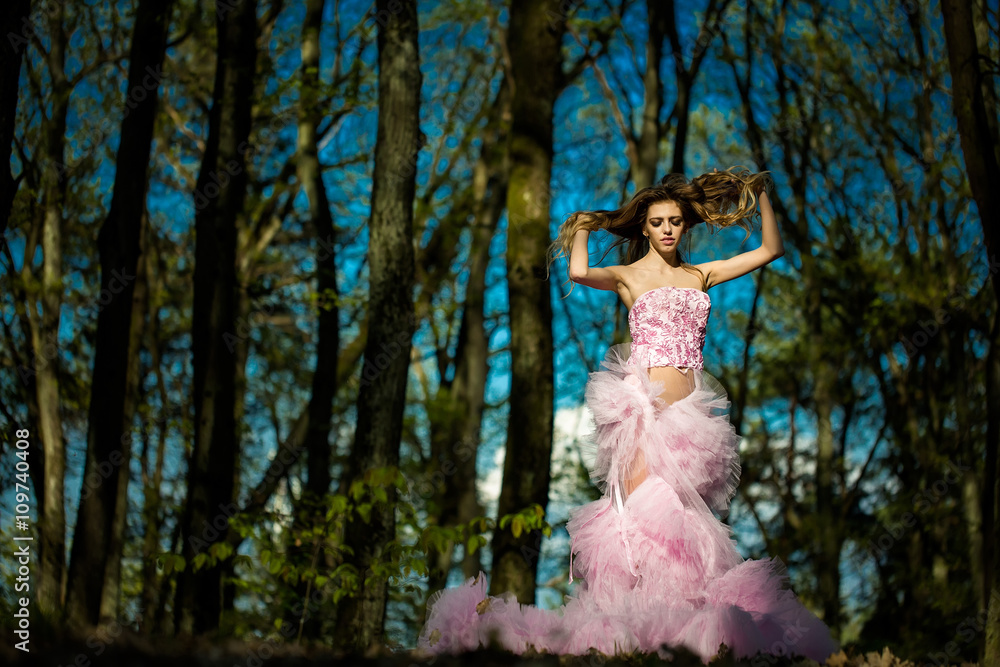 Glamour girl dancing in forest Glamour girl dancing in forest