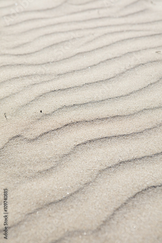 sand structures on a windy day at the beach of Sitges, Spain