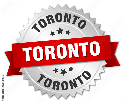 Toronto  round silver badge with red ribbon
