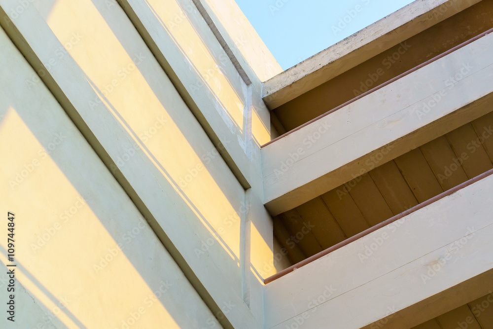 Building exterior, old building with sun light shadow Building exterior, old building with sun light shadow
