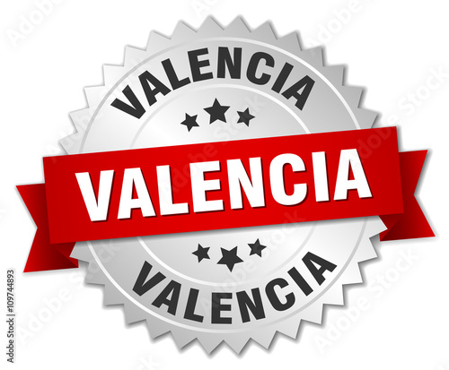 Valencia round silver badge with red ribbon