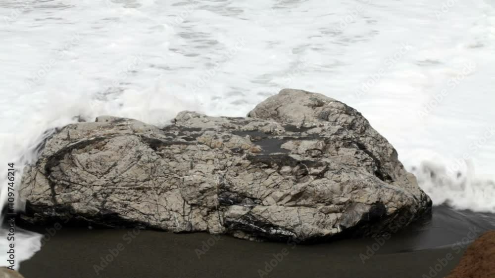Slow Motion Sea Water Surrounding Rock On Sandy Beach
Slow Motion Sea Water Surrounding Rock On Sandy Beach