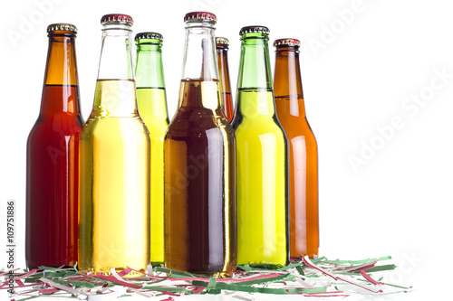 Unlabeled beers or cervesa with Cinco De Mayo holiday confetti photo