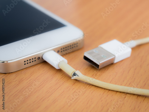 Broken charger cable with smart phone