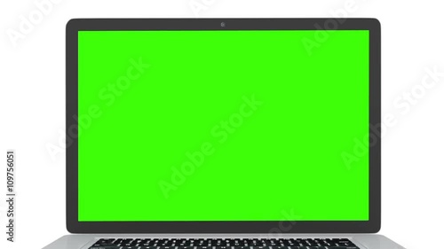 Isolated laptop with green screen on white background. Camera rotating around notebook. Template empty green screen.