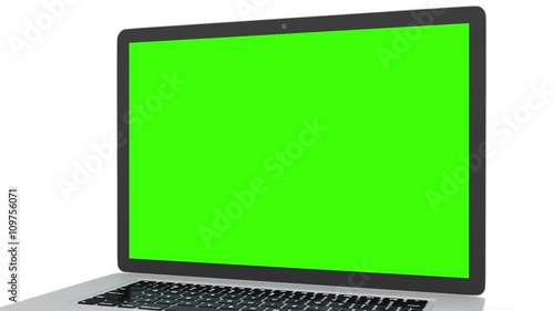 Isolated laptop with green screen on white background. Camera rotating around notebook. Template empty green screen.