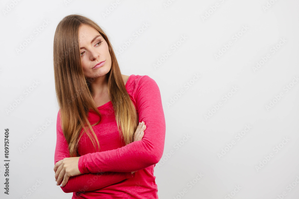 Young woman holding arms crossed. Young woman holding arms crossed.