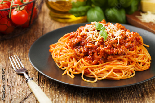 Vászonkép Delicious spaghetti served on a black plate