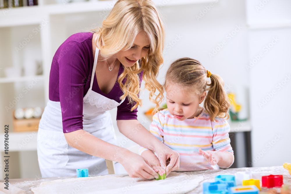Daughter and mother make cookies Daughter and mother make cookies