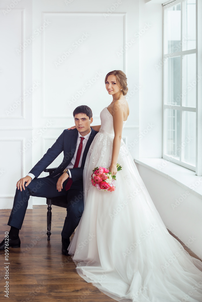 Bride and groom in very bright room