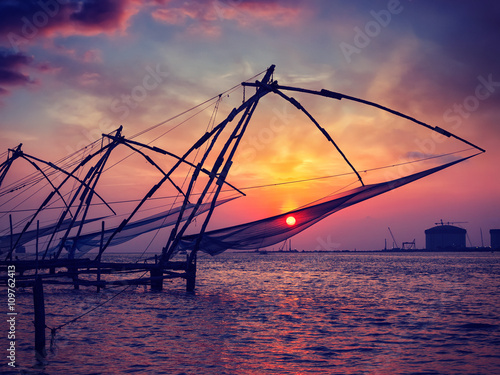 Photos Chinese fishnets on sunset. Kochi, Kerala, India